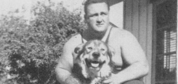 A strongman and his dog