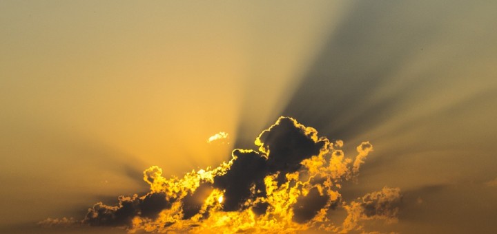 sun behind clouds