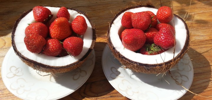 Strawberries inside coconut halves