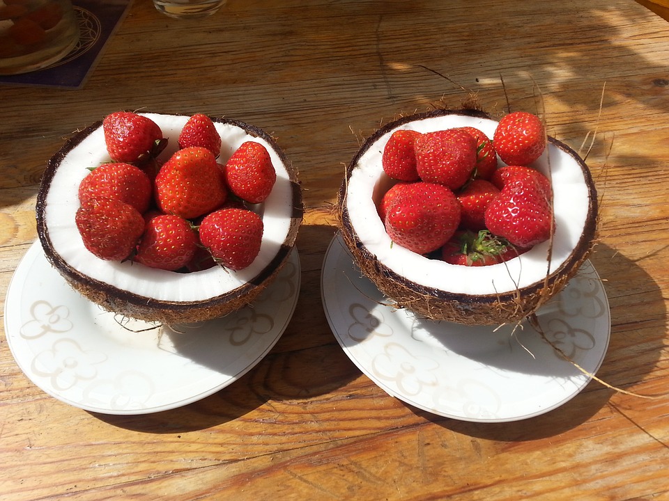 Strawberries inside coconut halves