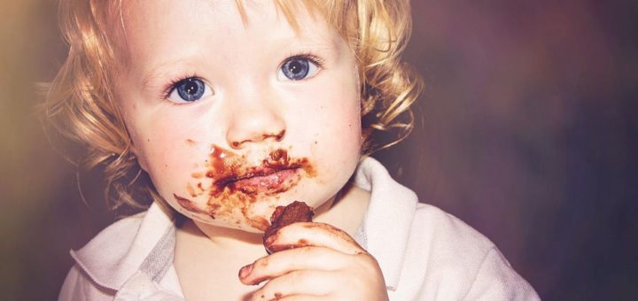 child eating chocolate